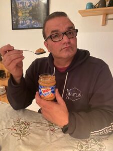 A man, his new German spoon, & Skippy Chunky Peanut Butter